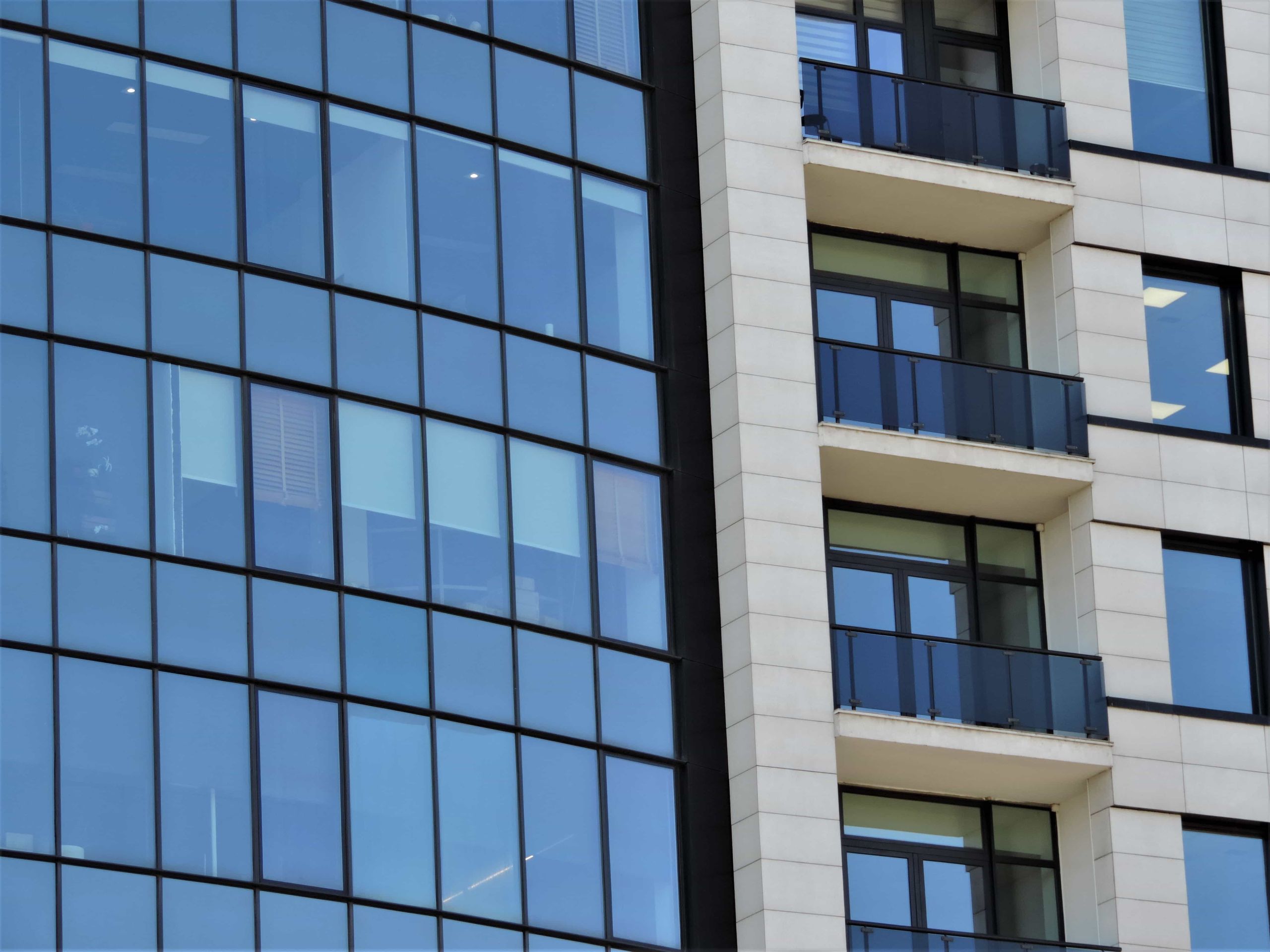 Modern apartment building with glass balconies
